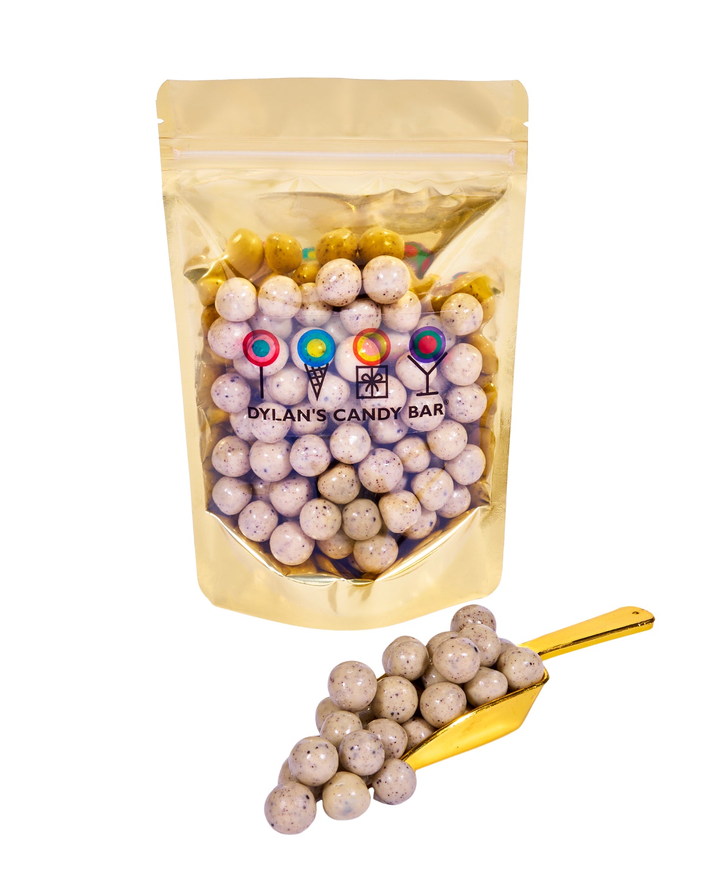 Cookies 'n Cream-Covered Caramel Bites in resealable gold mylar bag next to Cookies 'n Cream-Covered Caramel Bites overflowing from gold scoop